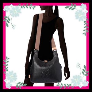 Black Orla Kiely midi sling embossed bag.